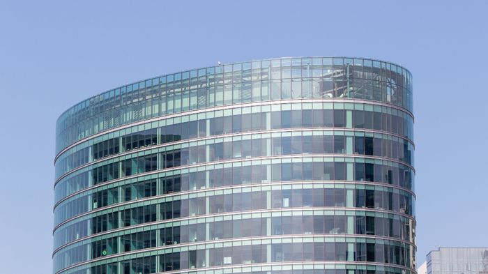 Curved glass facade of a modern office building